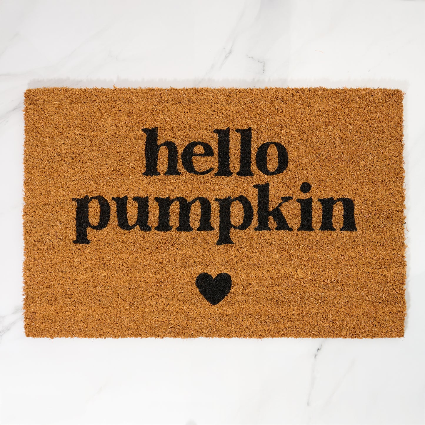 Doormat with 'hello pumpkin' text and a heart on a white background