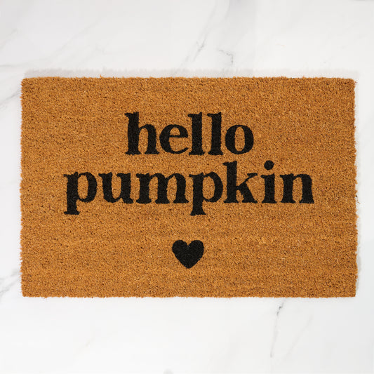 Doormat with 'hello pumpkin' text and a heart on a white background