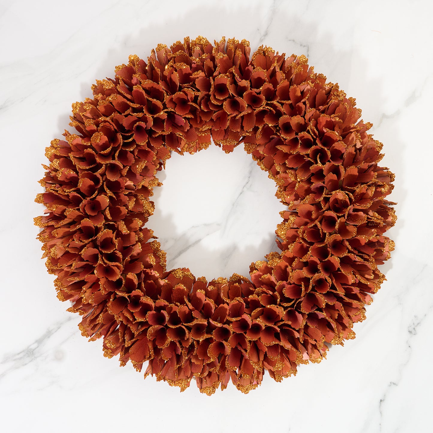 Decorative Autumn wreath on a white marble background

